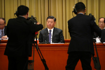 Chinese President Xi Jinping listens to a speech during an event to commemorate the 40th anniversary of the