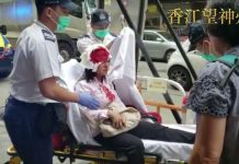 香港法轮功学员警署商讨十一游行路上遭二人疑持警棍打破头部事件幕后或来自中共势力操作